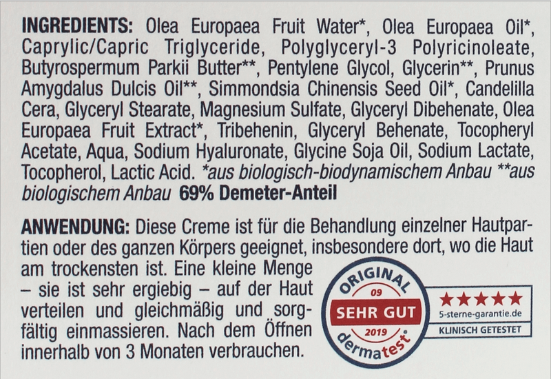 Inhaltsstoffe und Anwendungshinweise der OliPhenolia® Intensiv-Pflegecreme für Gesicht und Körper auf der Rückseite der Verpackung, inklusive Dermatest-Siegel „Sehr gut“ von 2019.