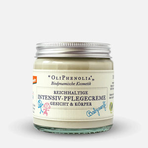 Glasdose der biodynamischen Pflegecreme ‚OliPhenolia‘ für Gesicht und Körper mit der Aufschrift ‚Reichhaltige Intensiv-Pflegecreme – Babyweich